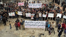 Syrian rebels captured a strategic neighborhood near Aleppo's international airport on Saturday, putting opposition fighters in control of a key road that the regime has used to ferry supplies and reinforcements to soldiers fighting in the embattled northern city, activists said.